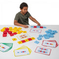 Connecting number tiles set with red, yellow, and blue tiles and number cards.