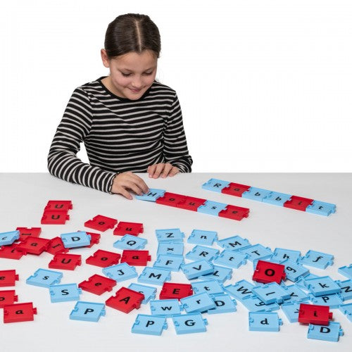 Colorful letter word building tiles in red and blue, connected on a tabletop