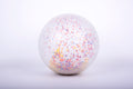 White inflatable confetti-speckled ball, close-up
