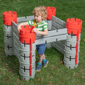 Constructa Castle plastic block toy with gray walls and red cylindrical towers