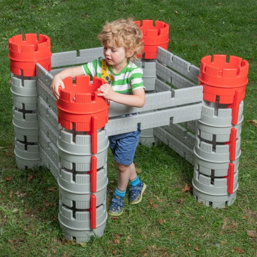 Constructa Castle plastic block toy with gray walls and red cylindrical towers