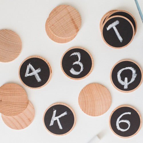 Wooden matching game cards with numerals 1-6 on black circles