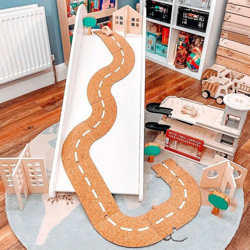 U-shaped brown cork road track mat with dashed white lane markings