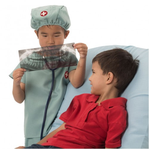 Dental x-ray protective cap with x-ray film held up by a child