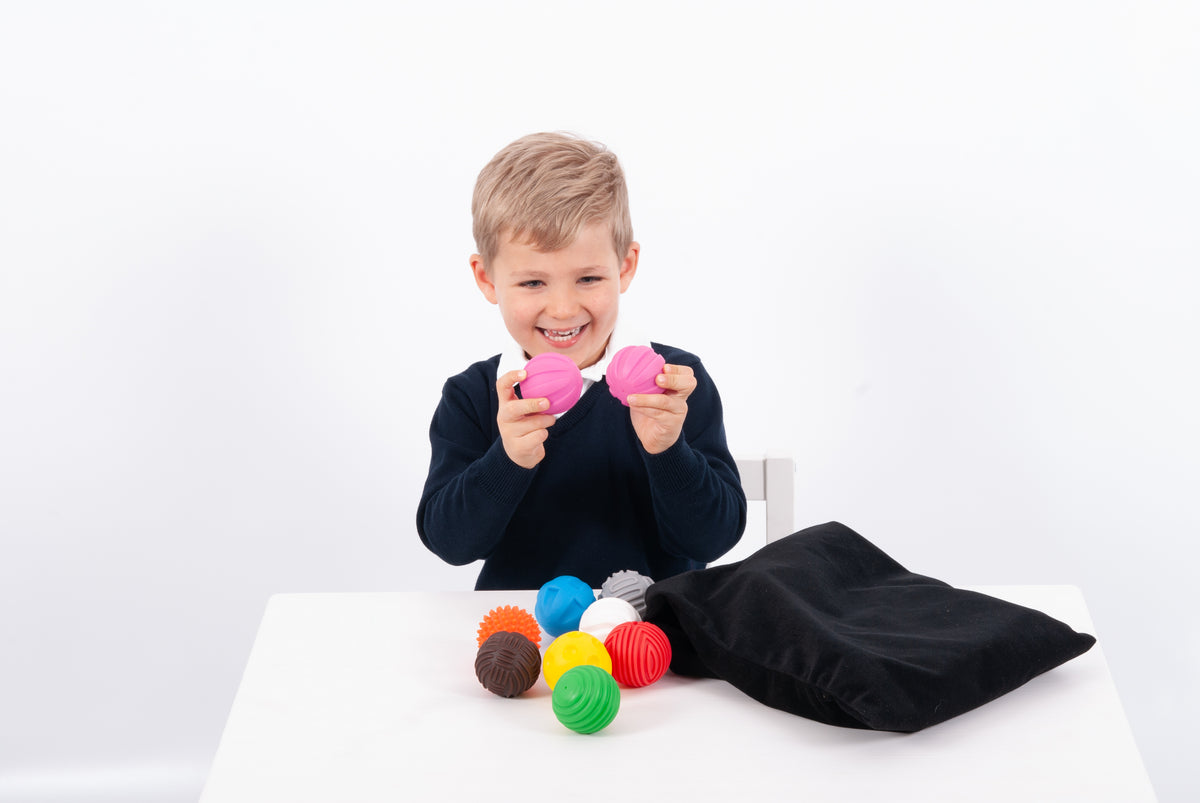 Kids play ball set with colorful textured balls and black carrying pouch