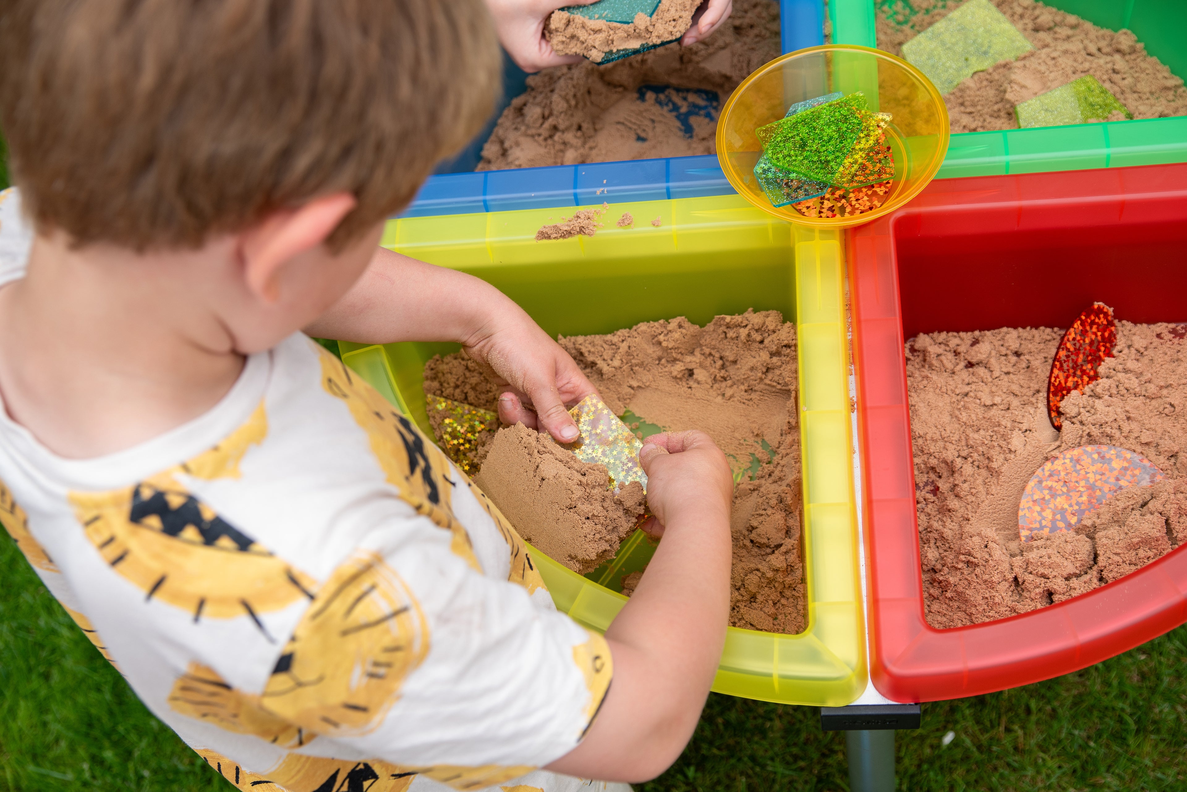 Quadrant color tray set with stand filled with sand in yellow, green, and red bins
