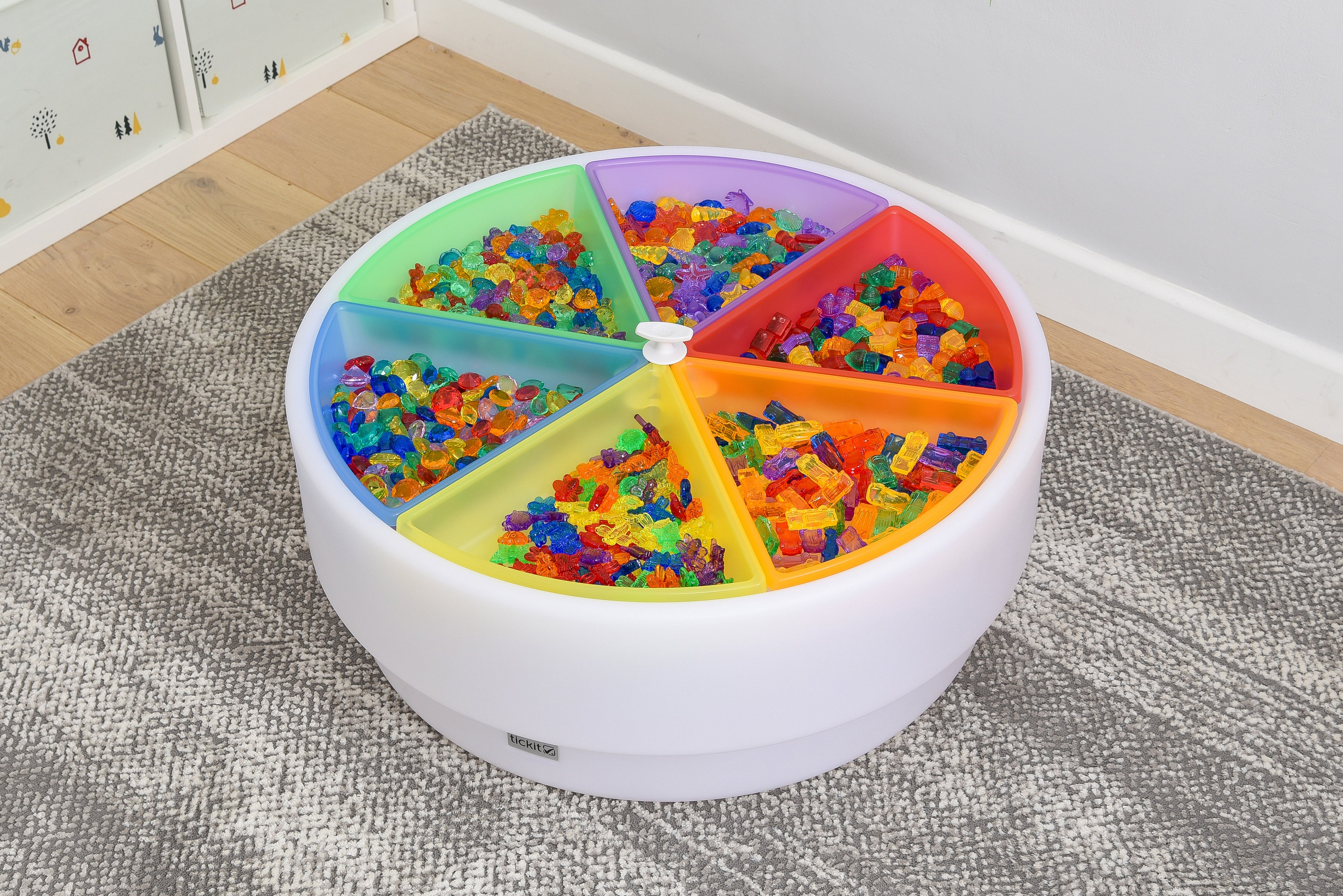 Round plastic color tray set with 6 rainbow compartments, filled with colorful blocks