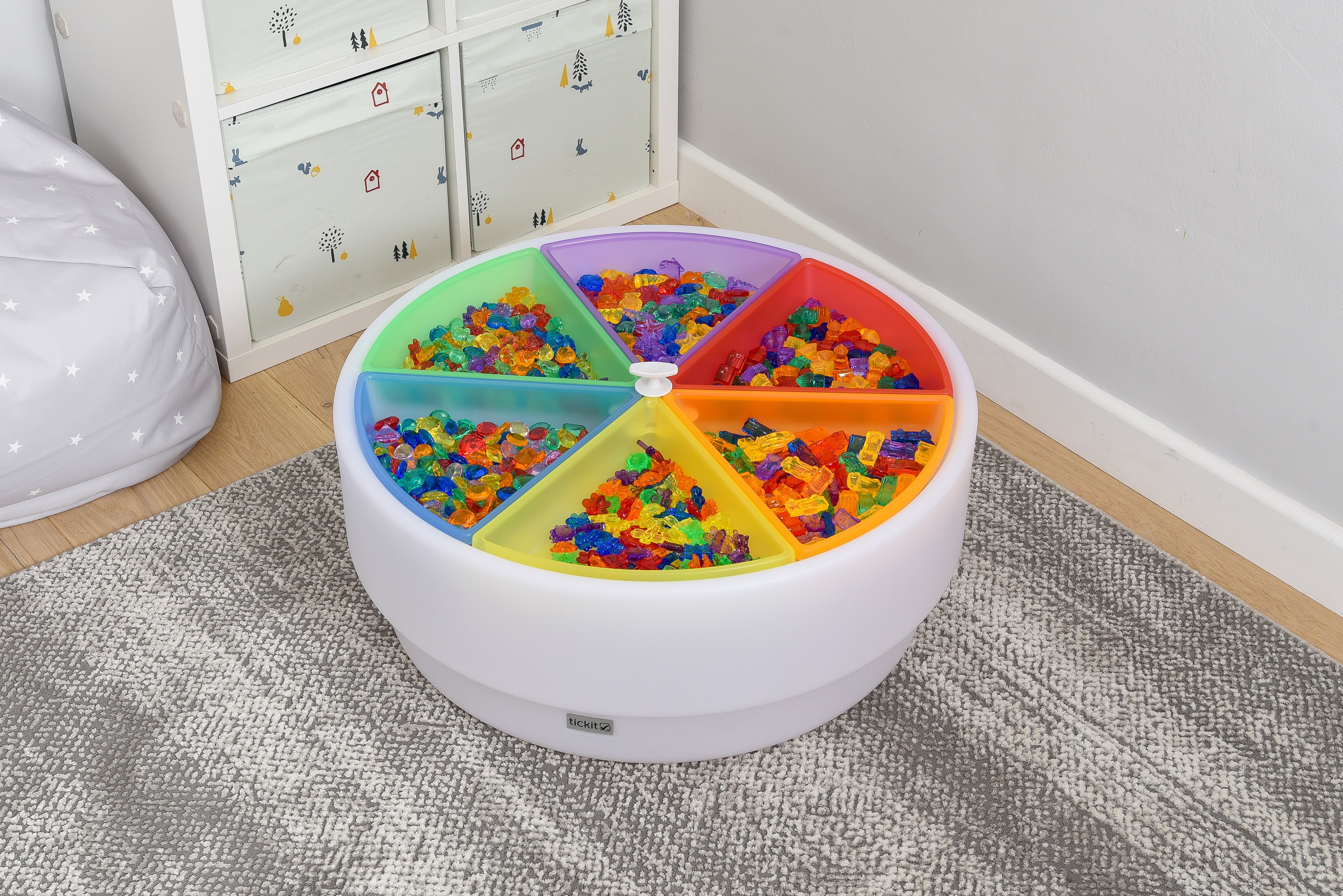 Round plastic color tray set with 6 rainbow compartments filled with colorful pieces
