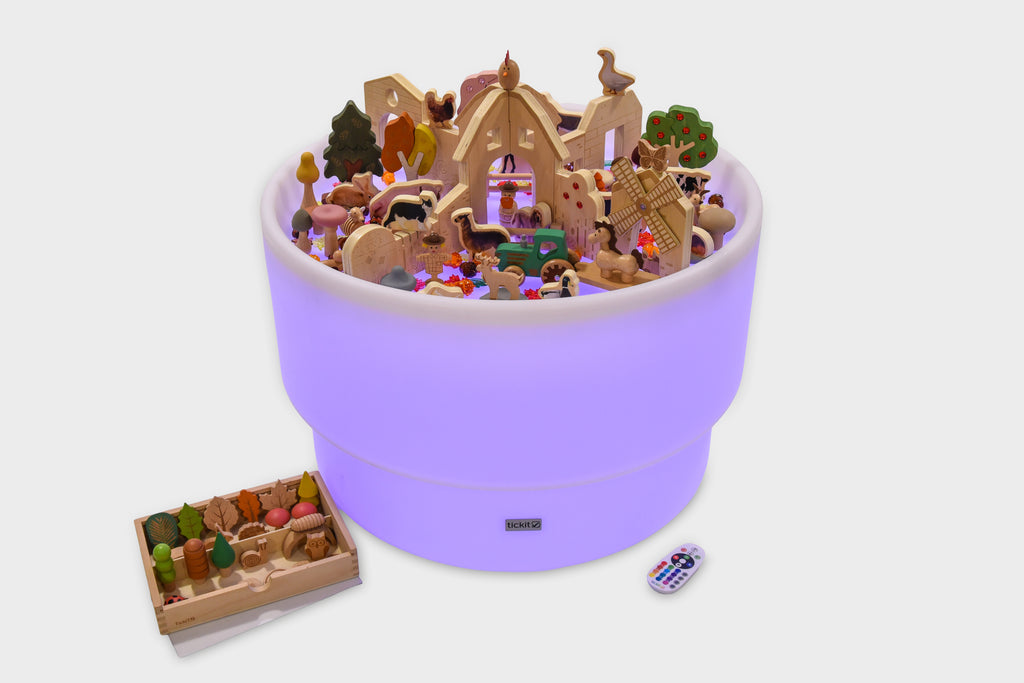 Purple round farm-themed playset container with miniature figures and accessory tray