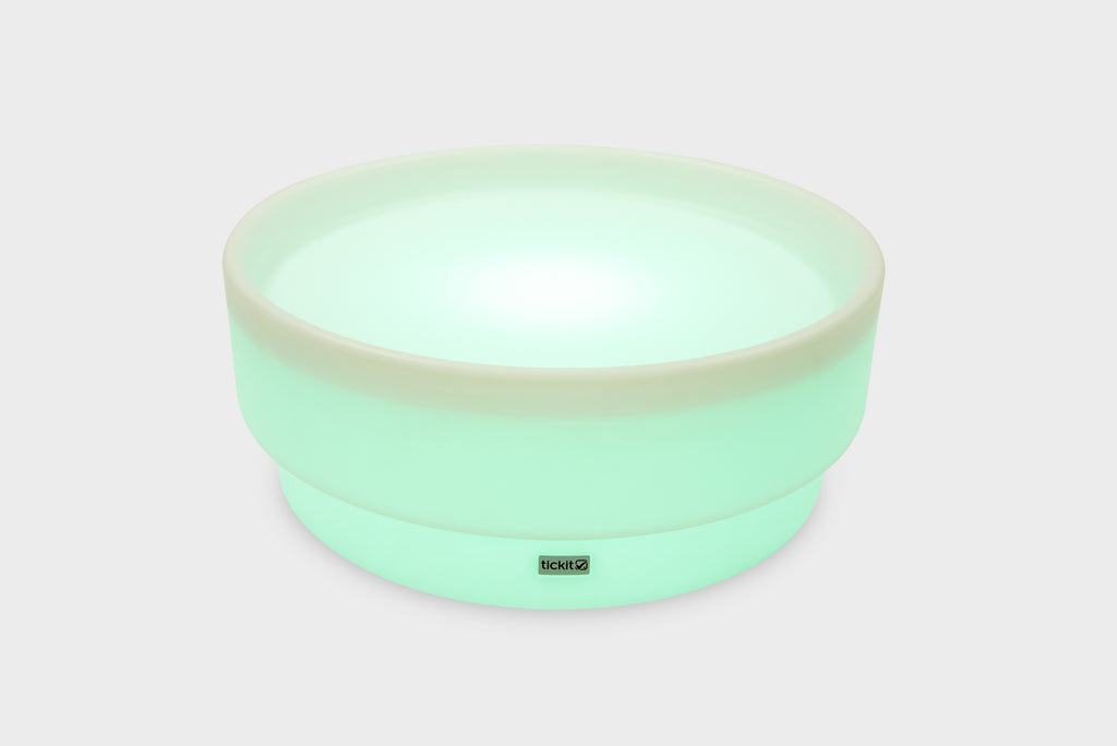 Mint green glow low table with bright round glowing surface