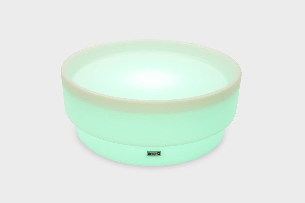Mint green glow low table with bright round glowing surface