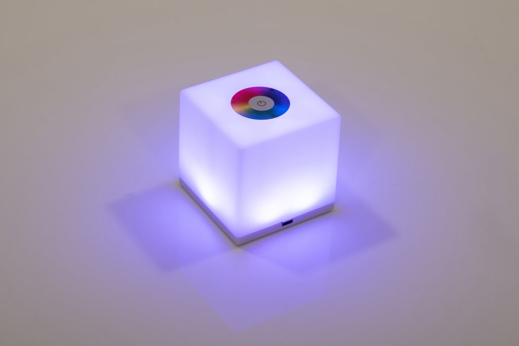 Mini cube LED lamp glowing purple-blue with circular top lens