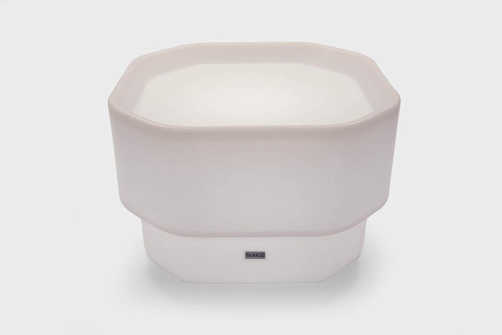 White mini round table with glow base and small center logo