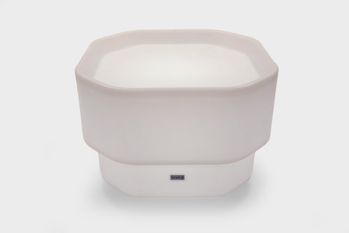 White mini round table with glow base and small center logo