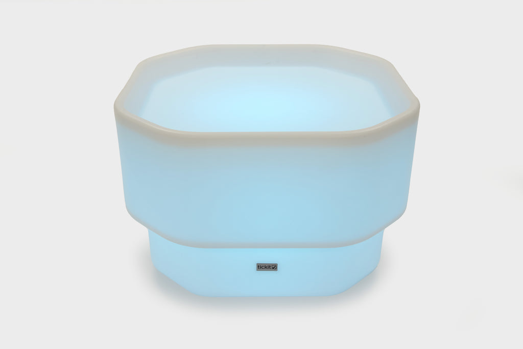 Light blue mini round table with glow base and small center logo