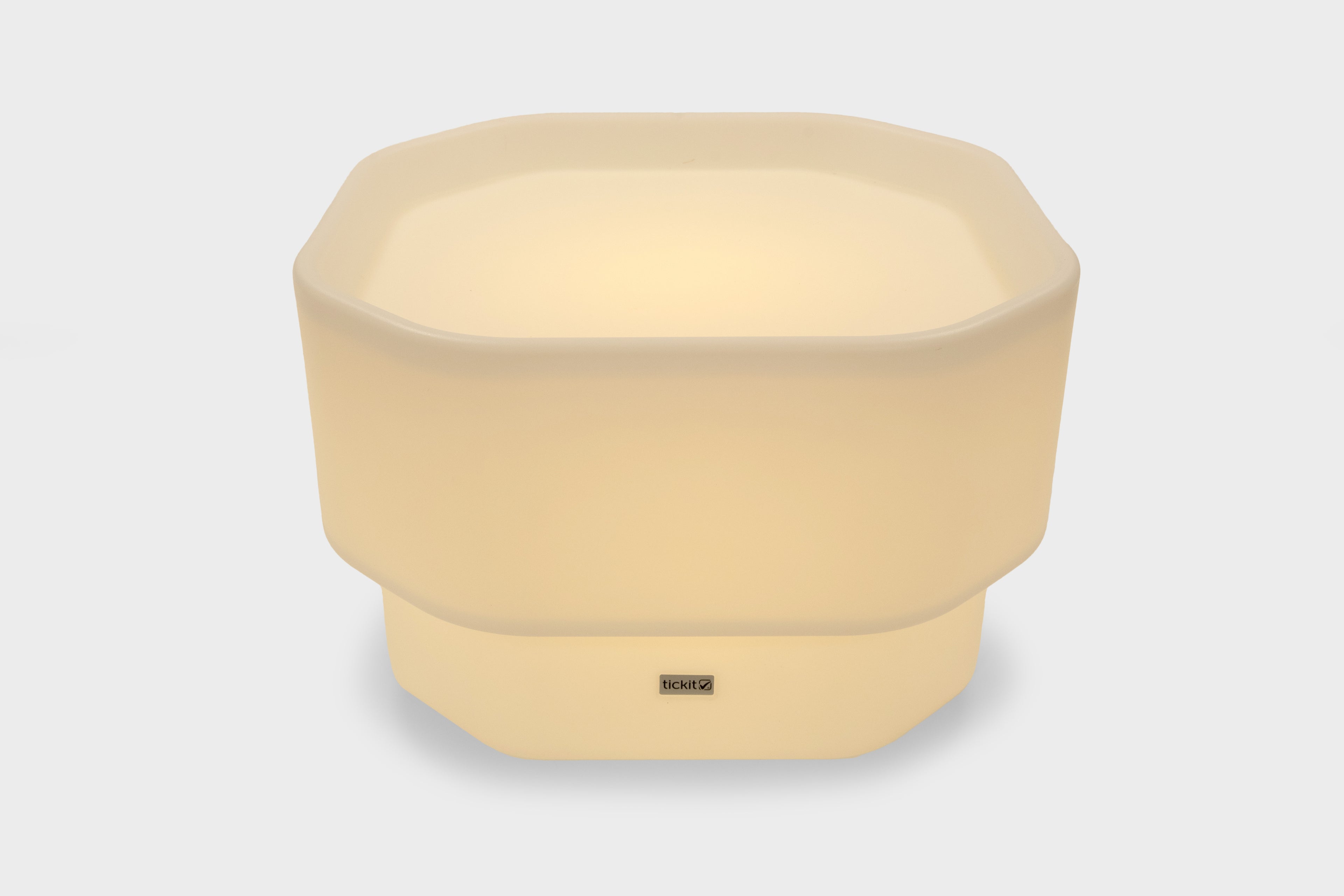 Pale yellow mini round table with glow base and small center logo
