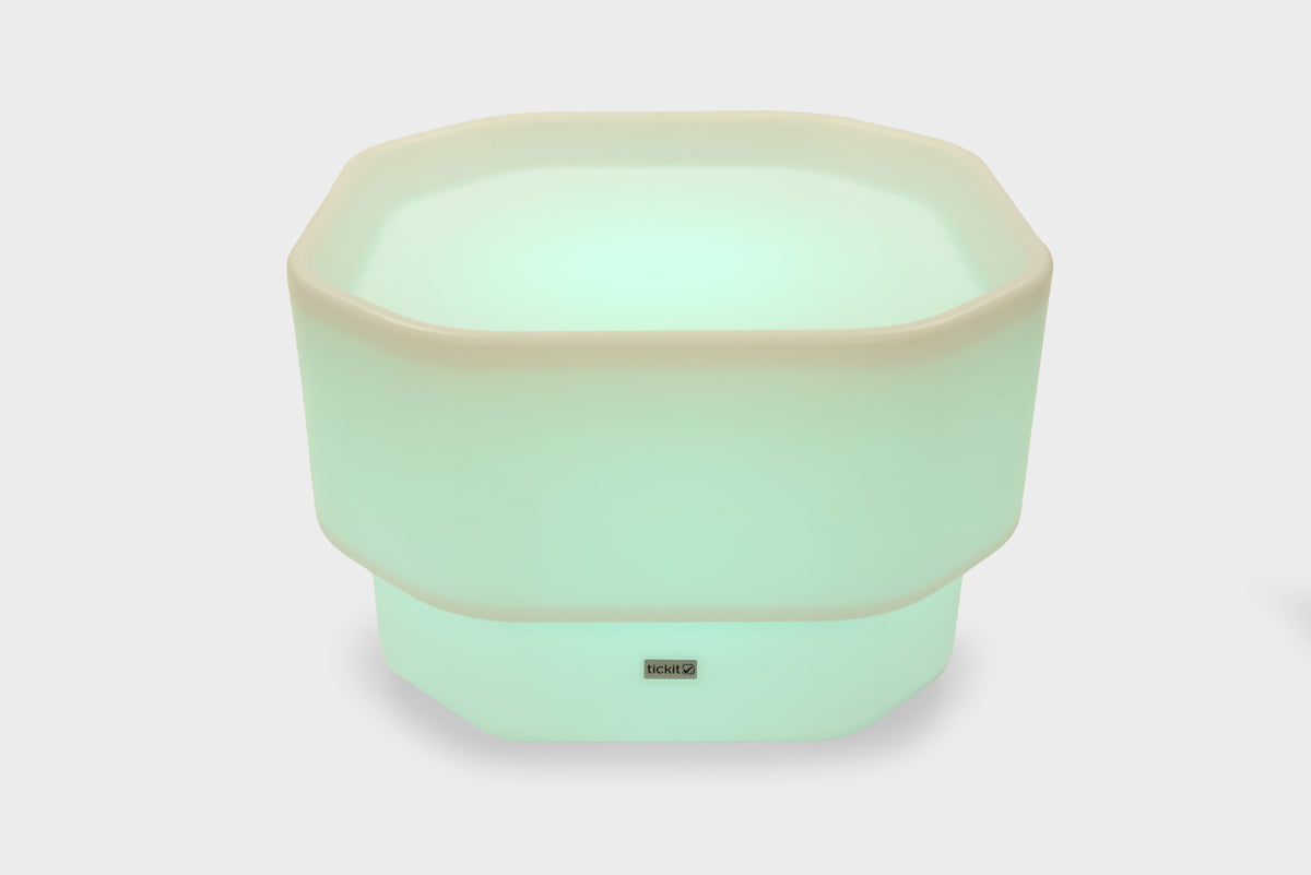Mint green mini round table with glow base and small center logo