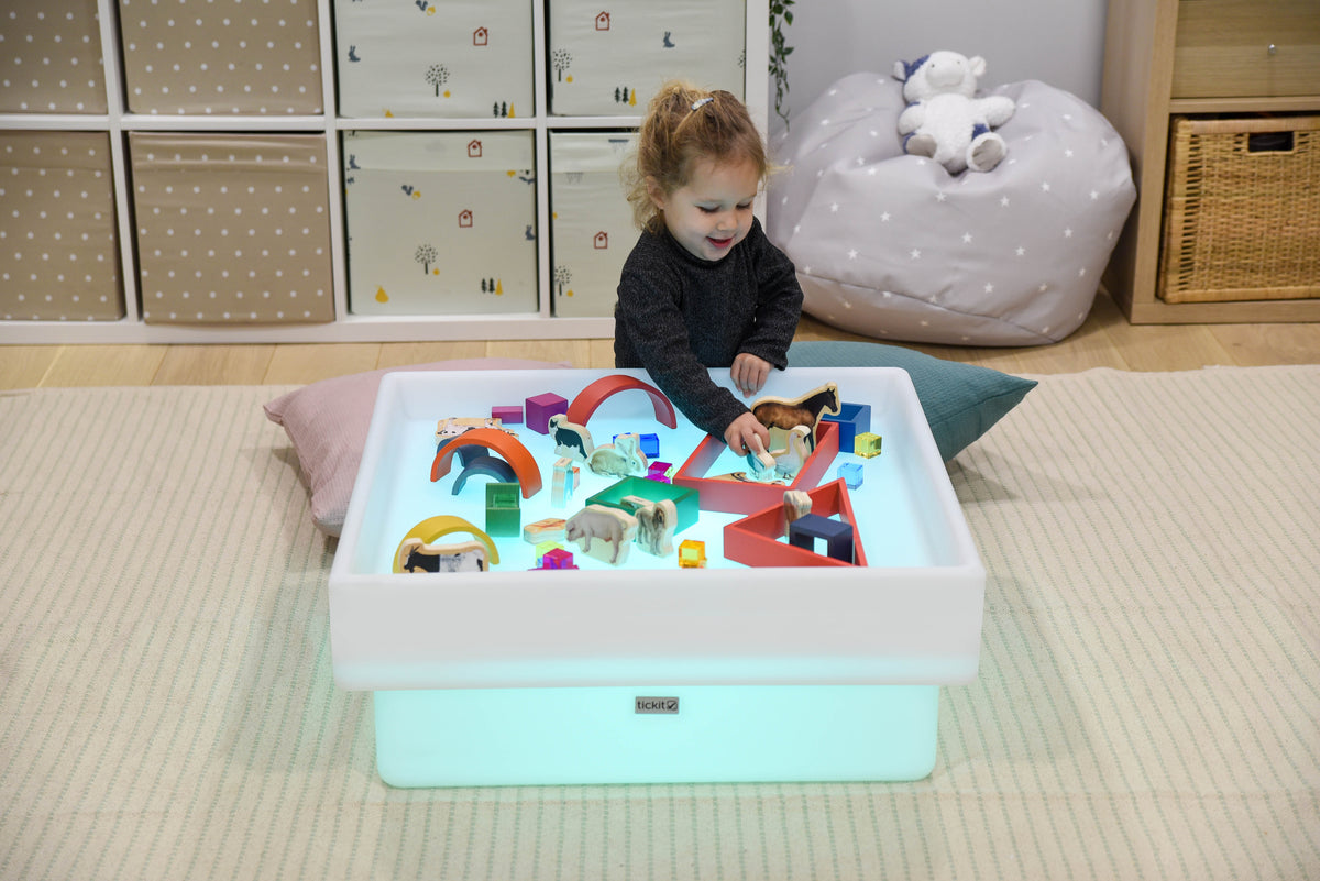 Square glow play table with white tray and colorful building blocks
