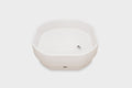 White hexagonal glow table with small power indicator on front