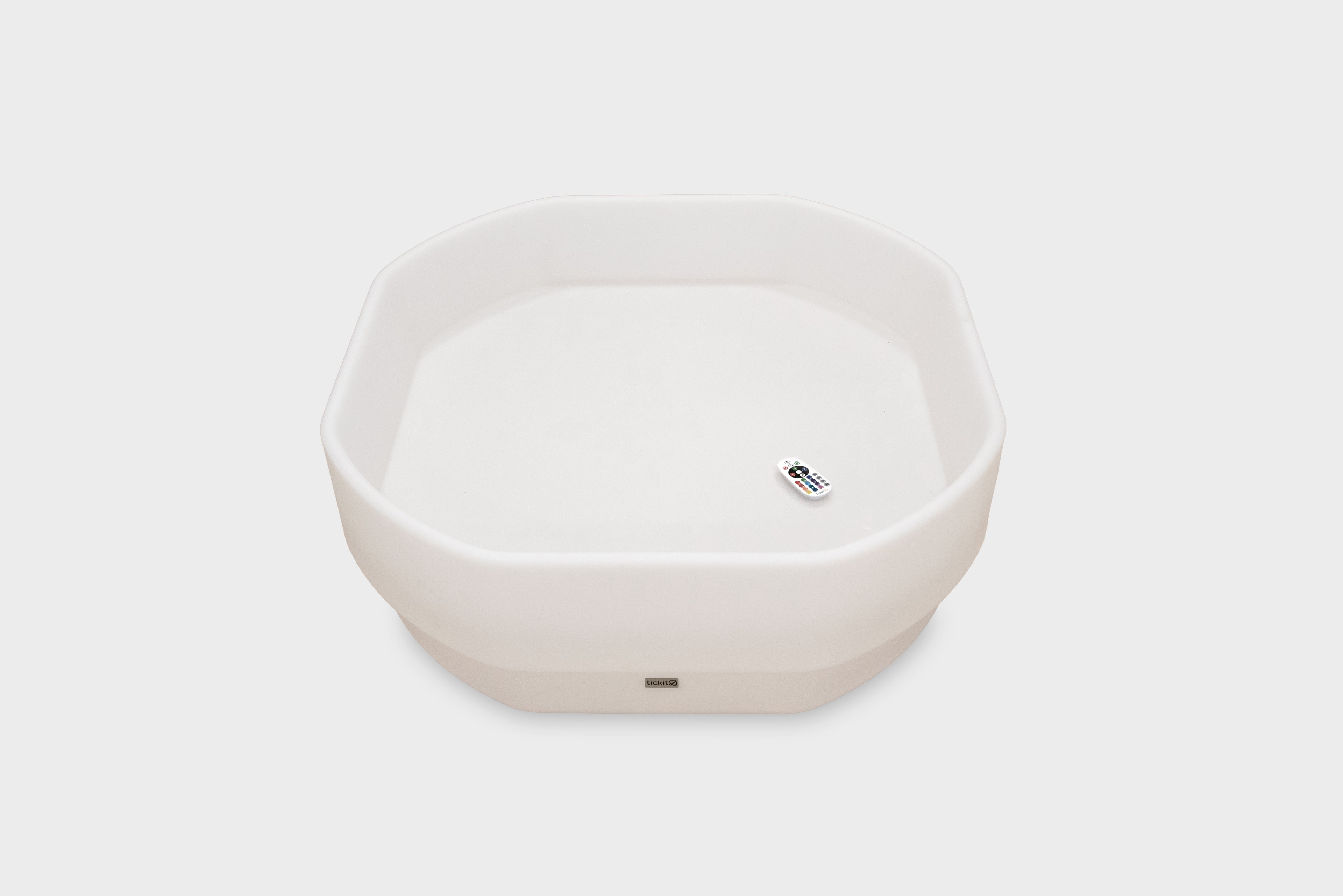 White hexagonal glow table with small power indicator on front