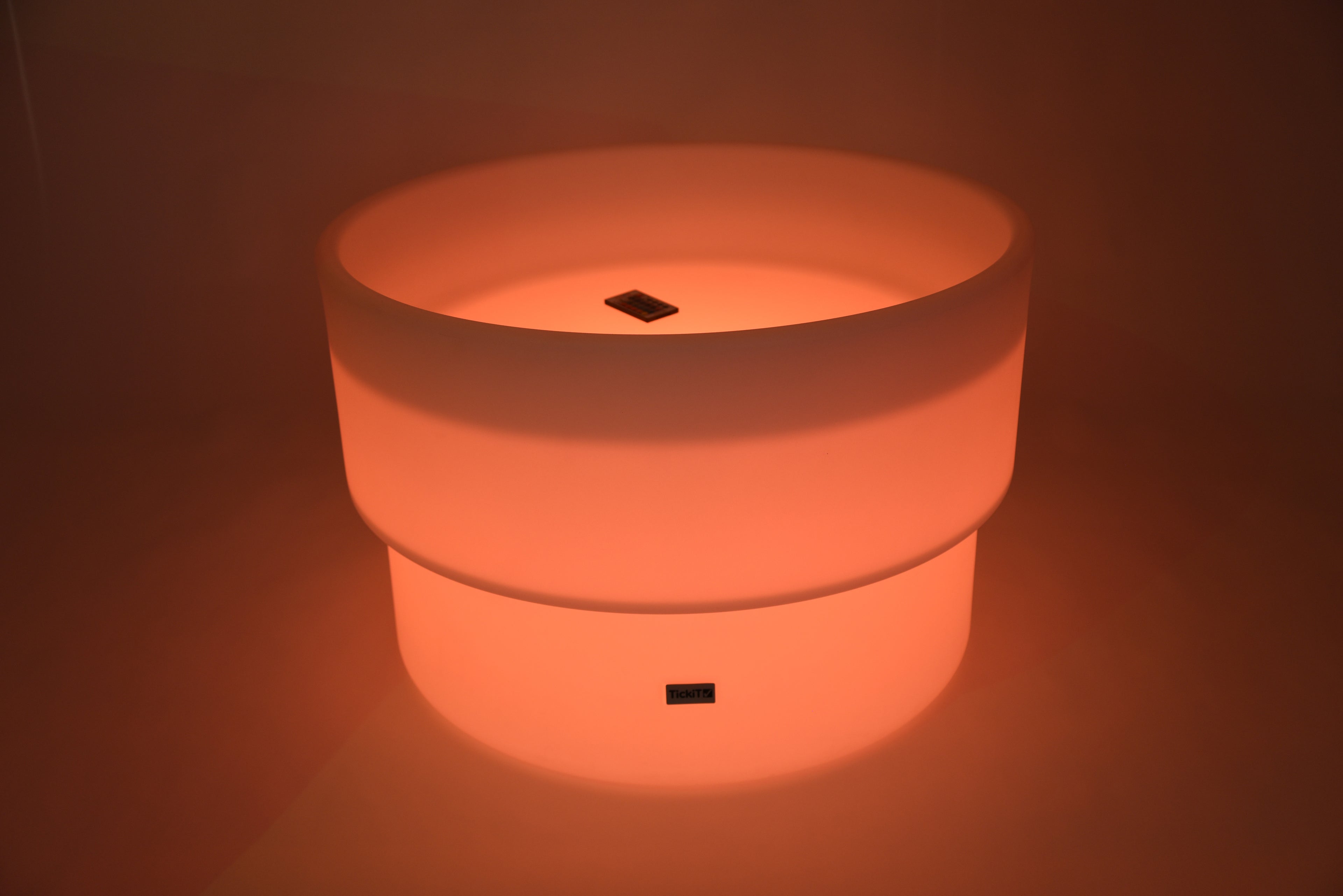 Glowing LED water table, orange light, round top