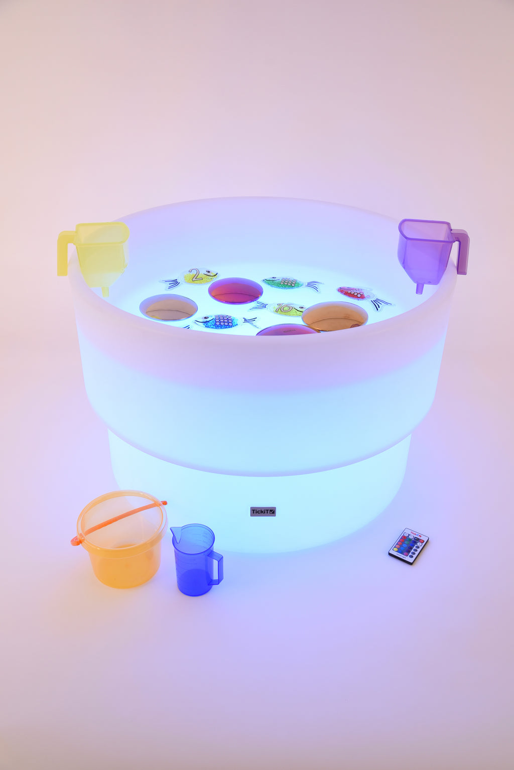 Glowing water table with colorful light, side handles, and play accessories
