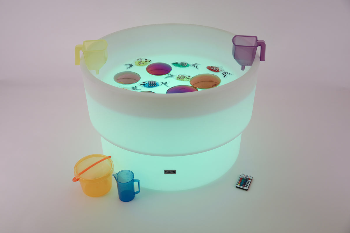 Glowing water table with multicolor game surface and blue cup accessories