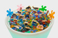 Round sea-themed table with colorful ocean animal toys, shells, and coral