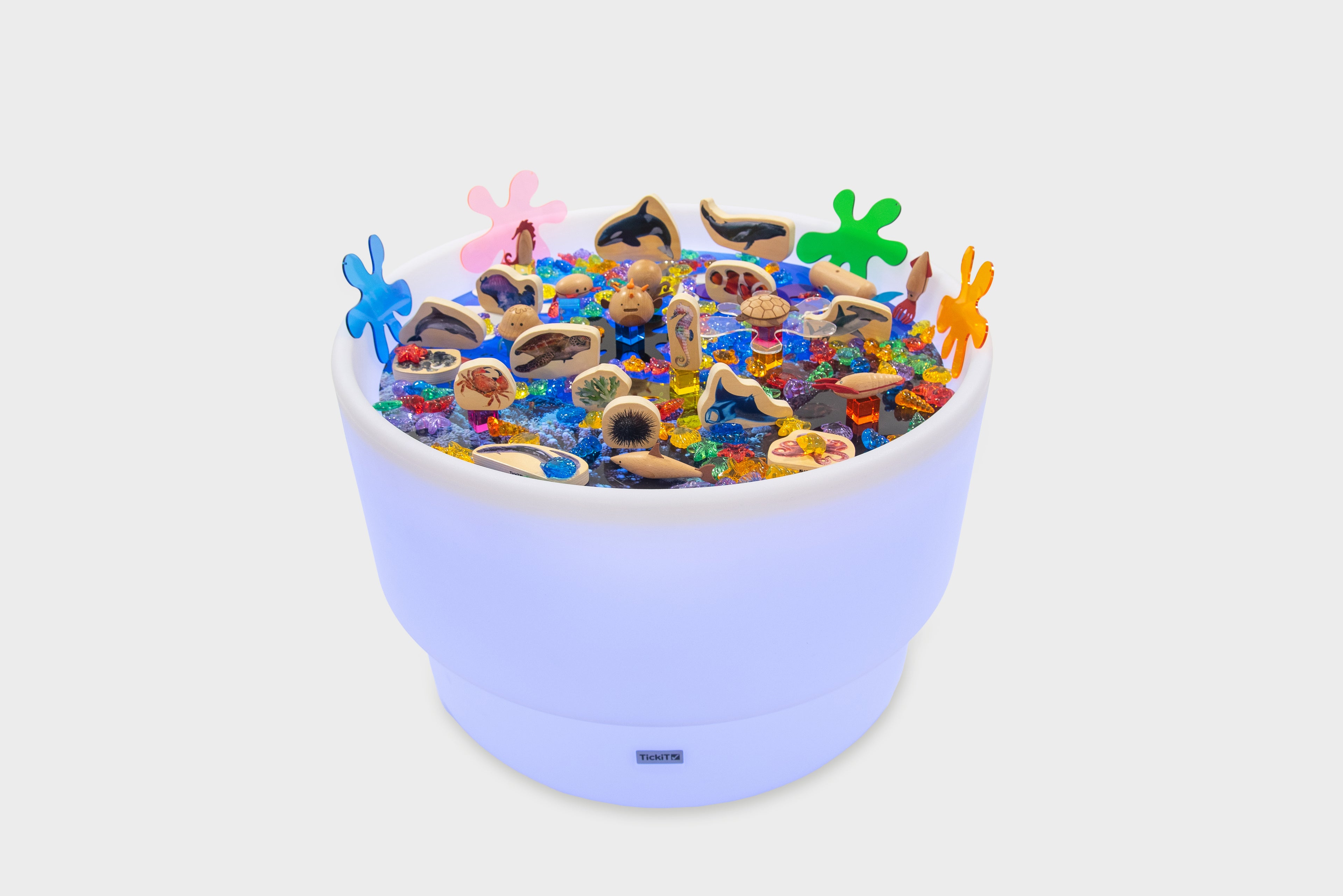 Pastel lavender sea-themed table bundle filled with ocean animal toys and shells