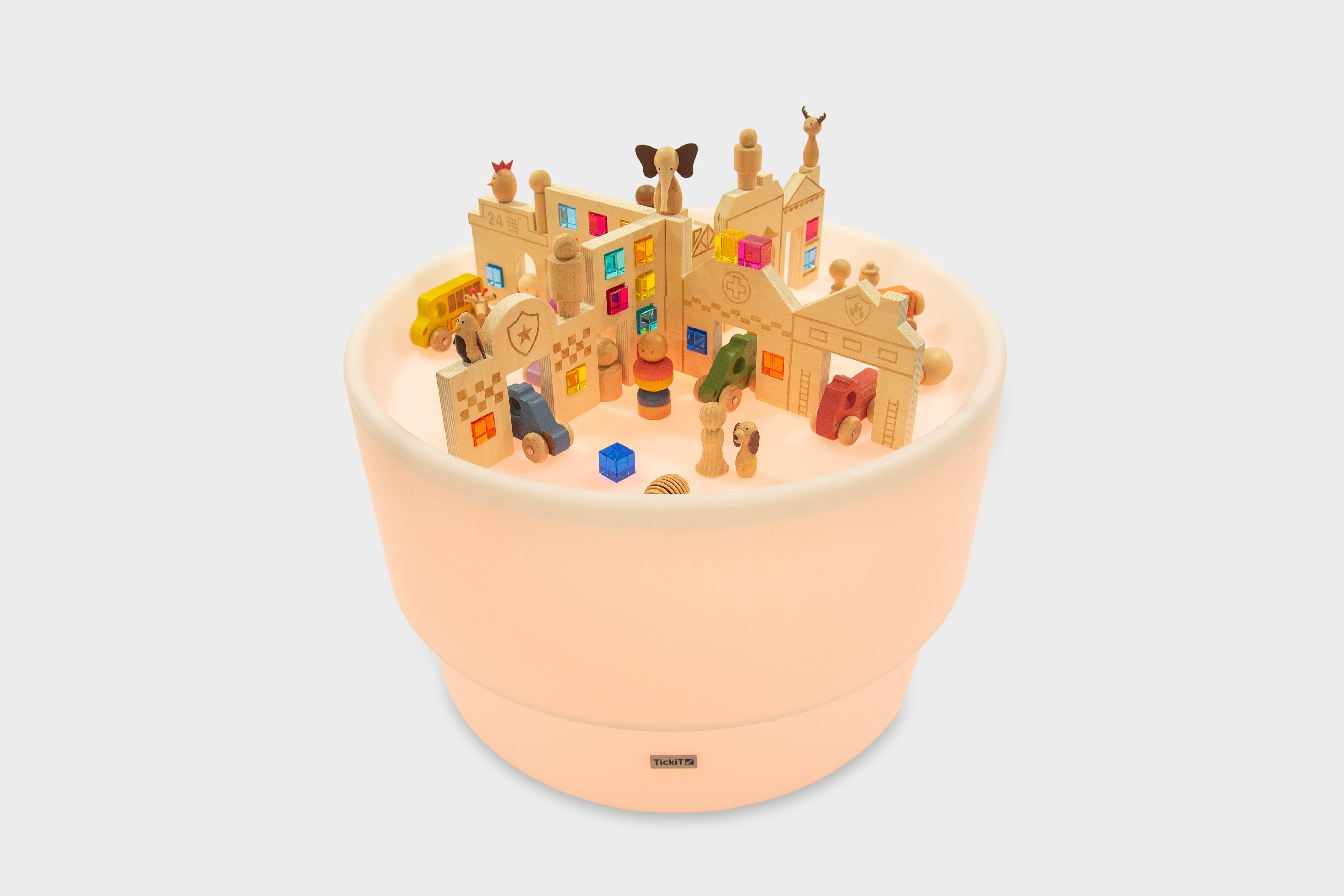 Discovery Town play table with miniature buildings, vehicles, figures, and blocks inside