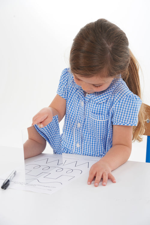 Double-sided mirror sheet on a desk