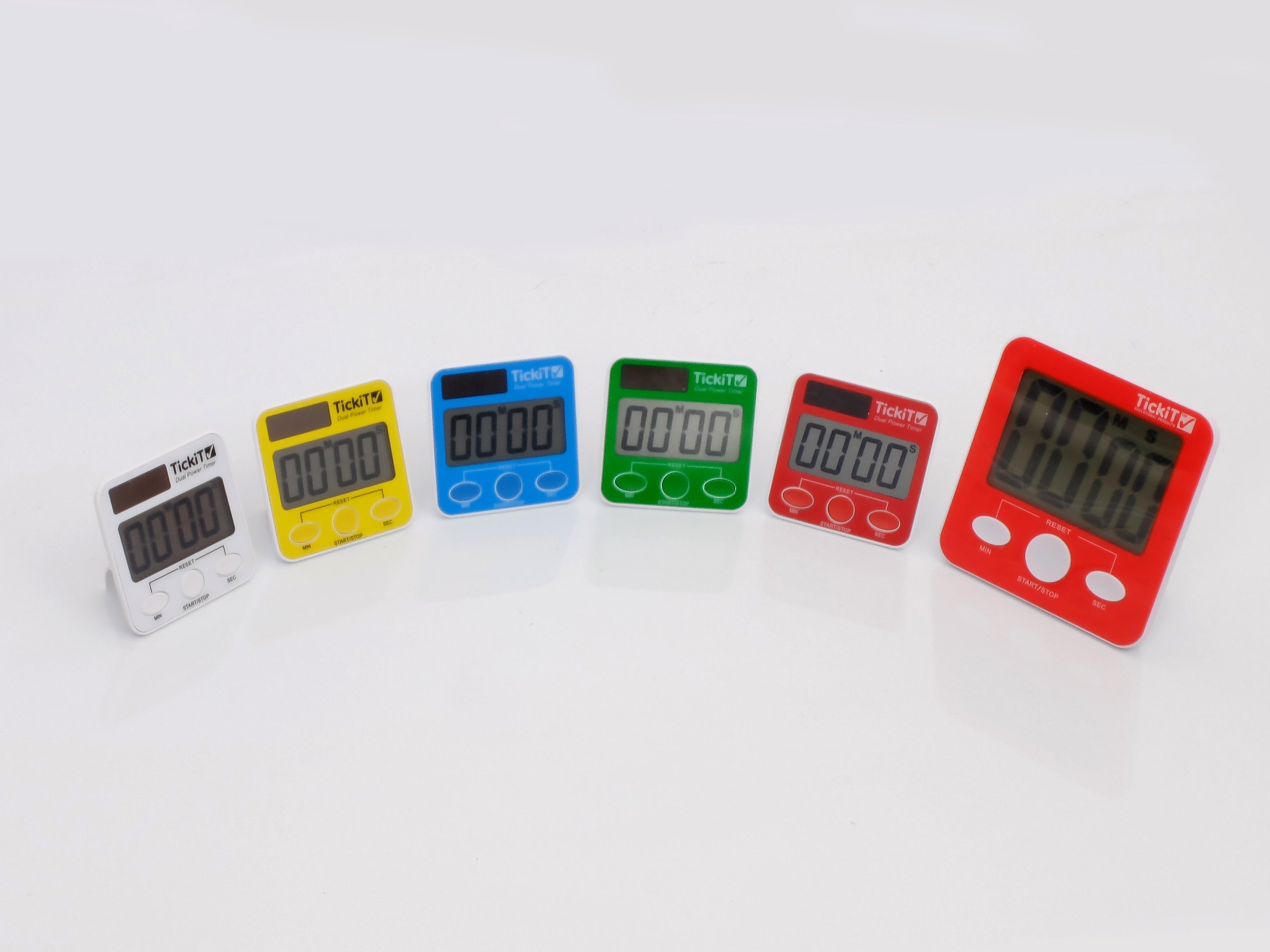 Assorted dual power digital timers: yellow, blue, green, red, and gray.