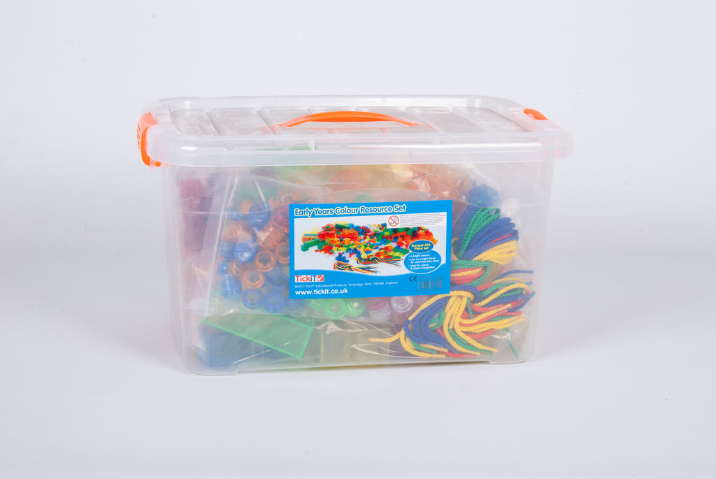 Clear plastic storage tub of multicolor craft pieces with instruction card