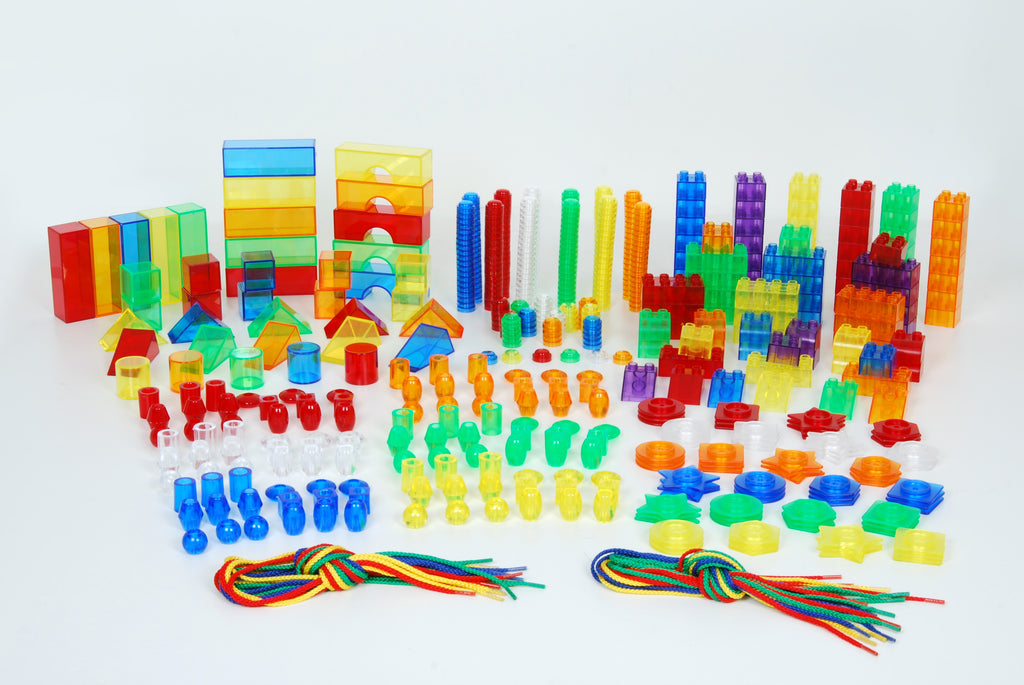 Assorted multicolor plastic building pieces, rods, cylinders, and colored cords