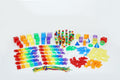 Stackable colored number blocks, counting rods, and measurement tiles with laces