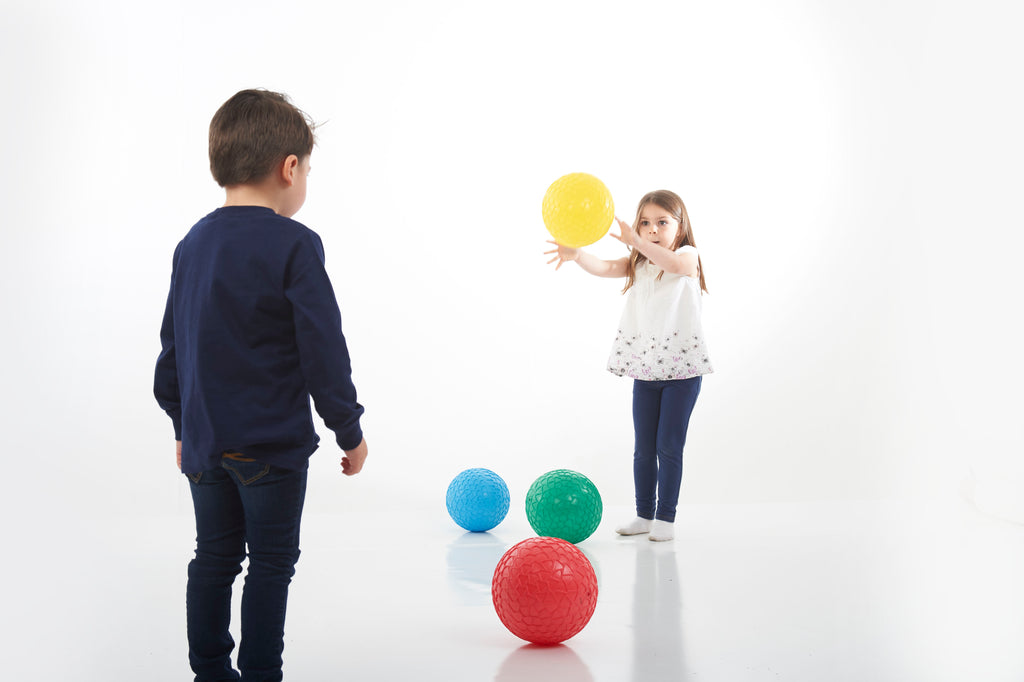 Set of 4 textured grip balls clustered: blue, green, red, and yellow