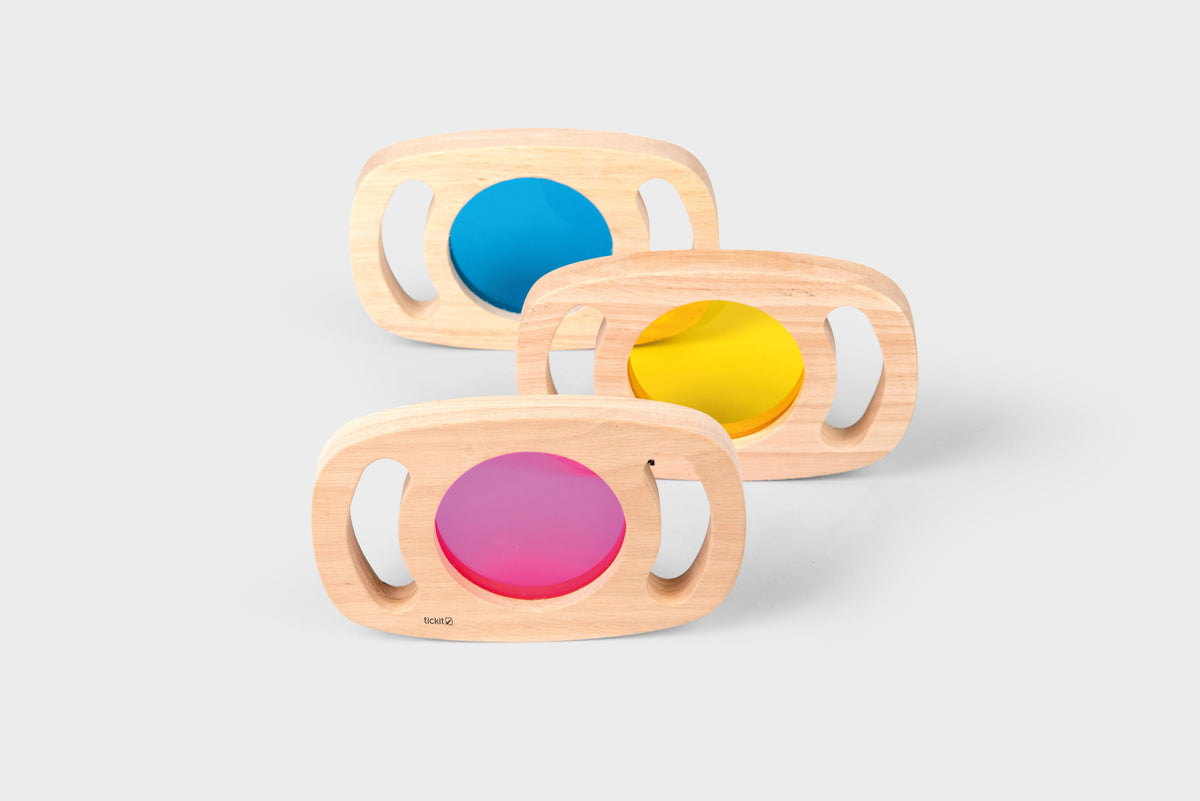 Set of wooden color panel frames with translucent blue, yellow, and pink windows