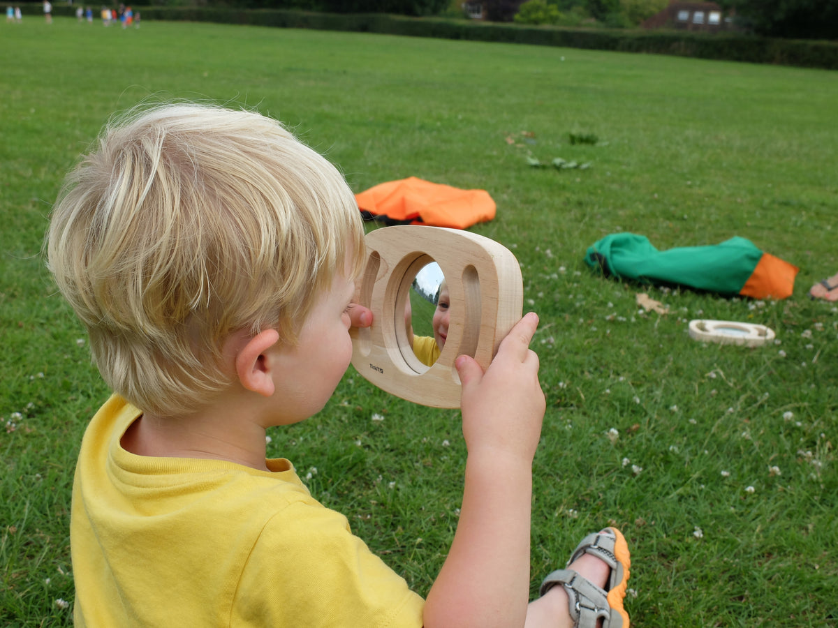 Light wood oval double-sided mirror toy with convex and concave lenses