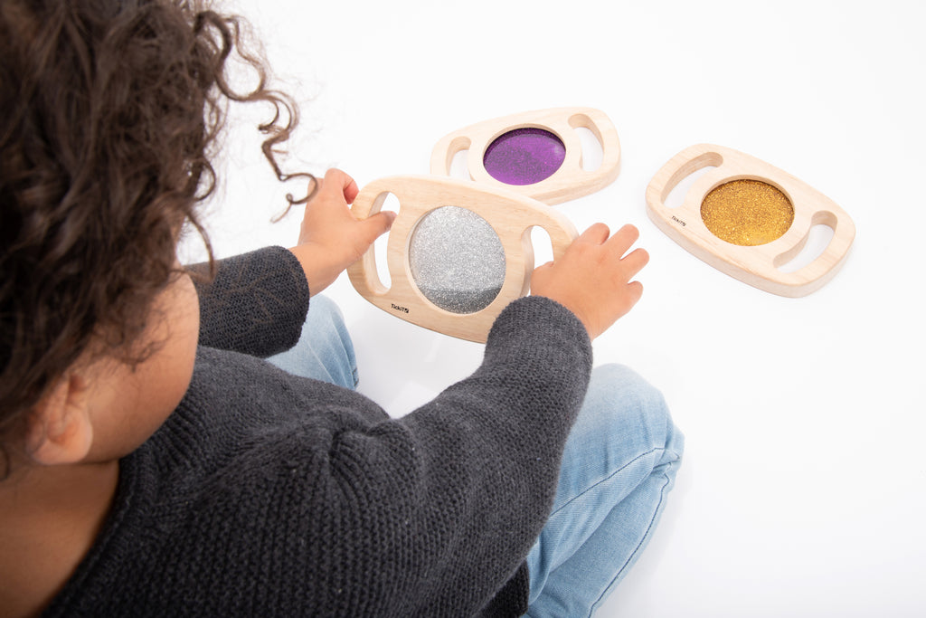 Wood glitter panel set toy with oval frames featuring purple and gray sparkly inserts