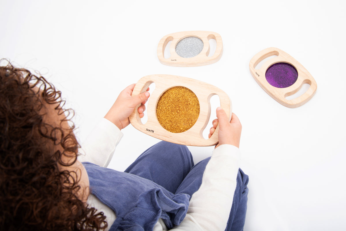Wood glitter panel set toy: one hand-held oval frame with gold sparkly insert, two others