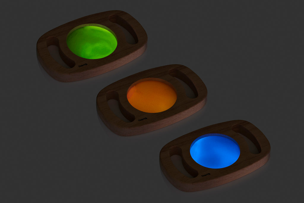 Set of wooden glow panels with green, amber, and blue illuminated discs
