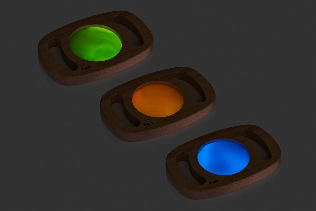 Set of wooden glow panels with green, amber, and blue illuminated discs