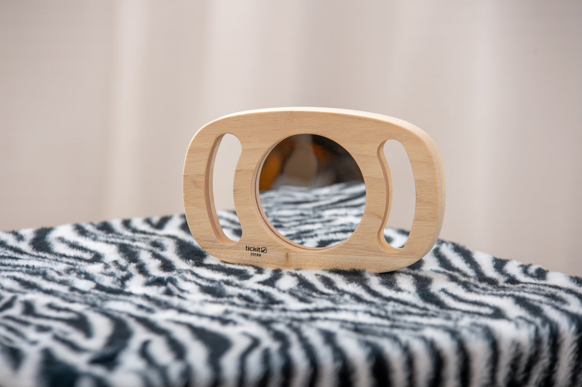 Wooden oval mirror with rounded handles, reflective glass insert