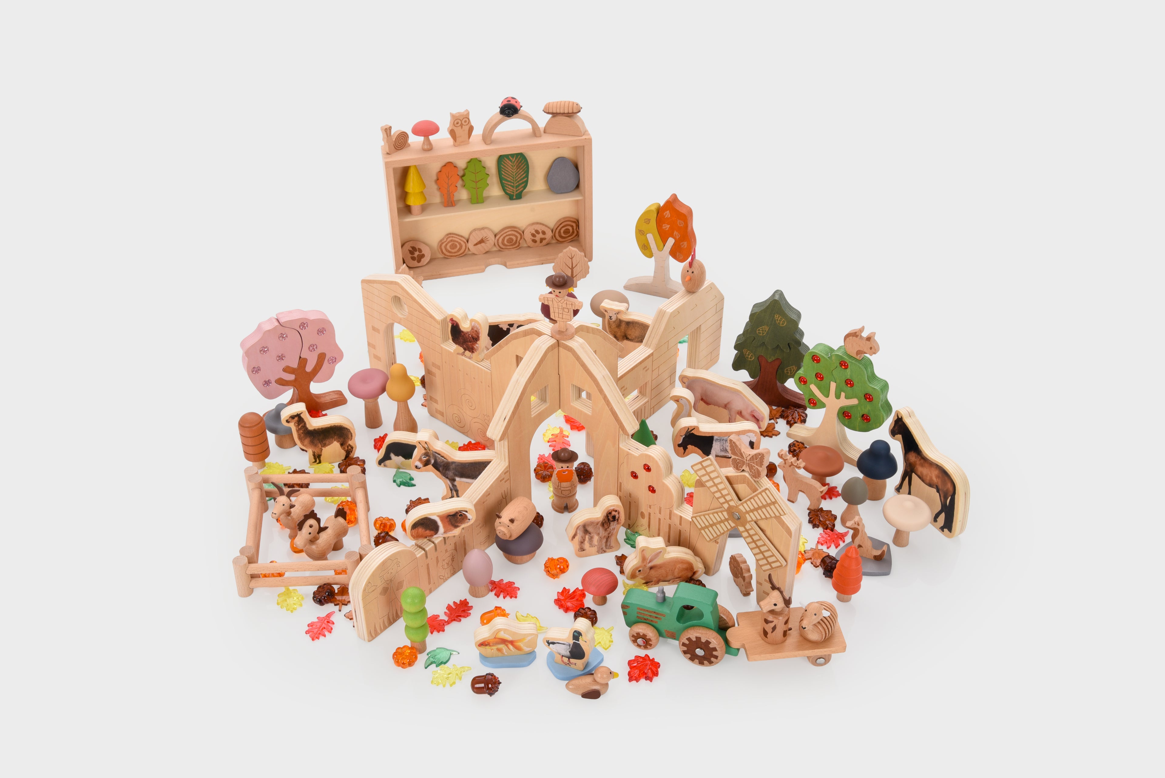 Wooden farm resource toy bundle with animals, trees, and play accessories laid out.