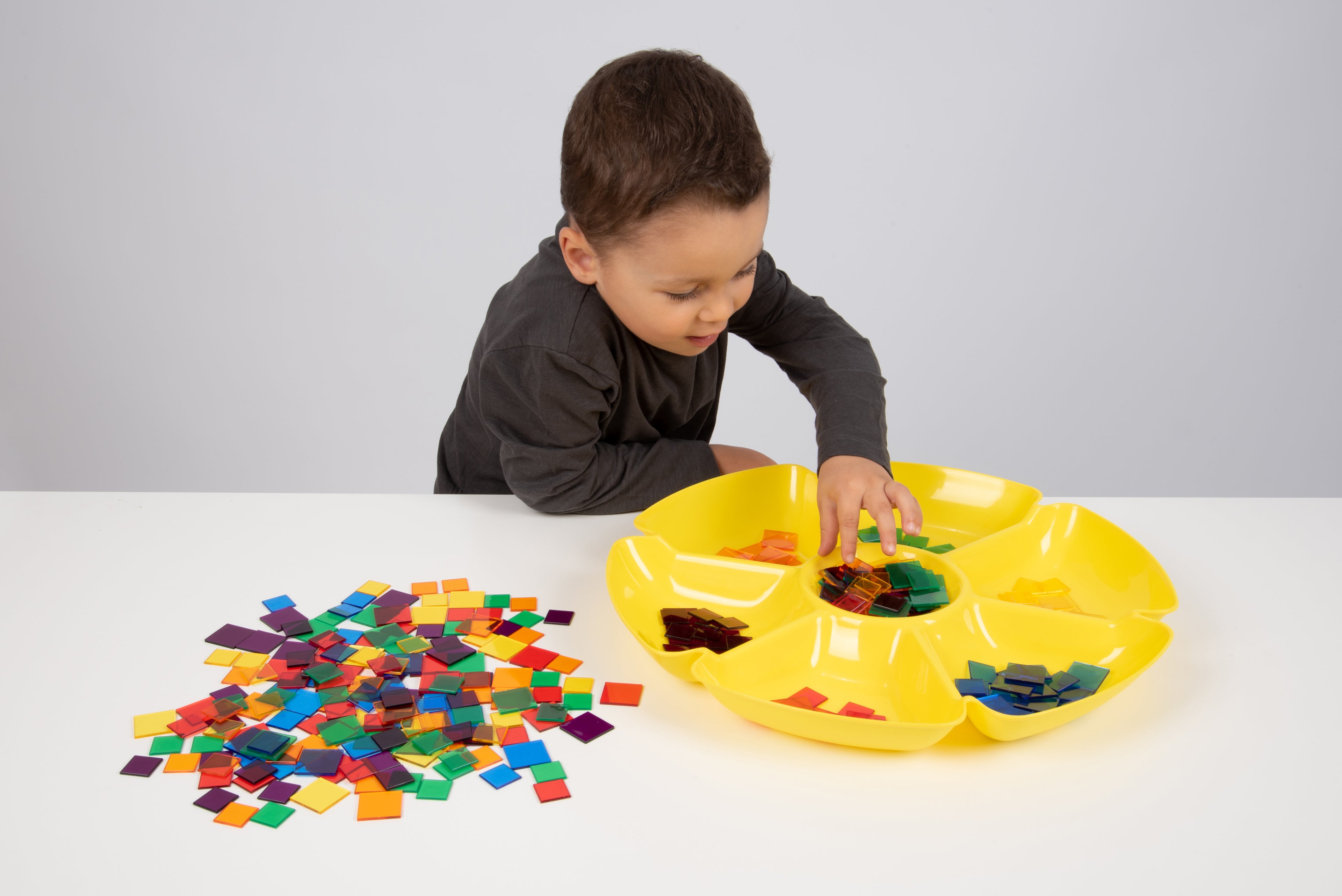 Yellow flower-shaped paint tray with center cups and multiple small compartment wells