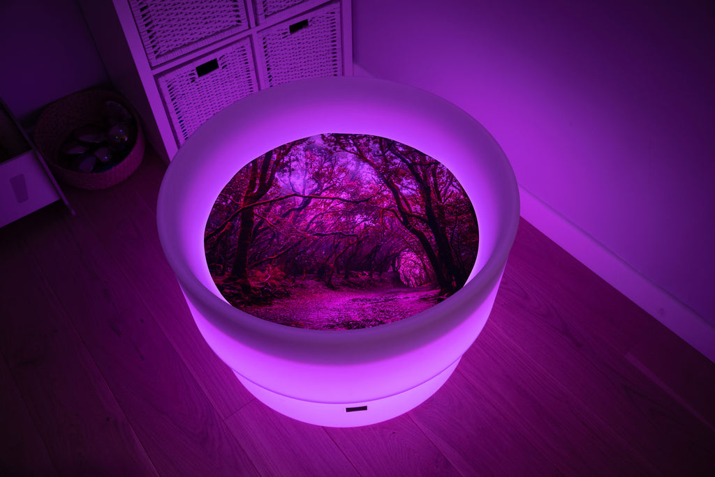Round forest-themed play mat with glowing rim and forest path insert, purple lighting