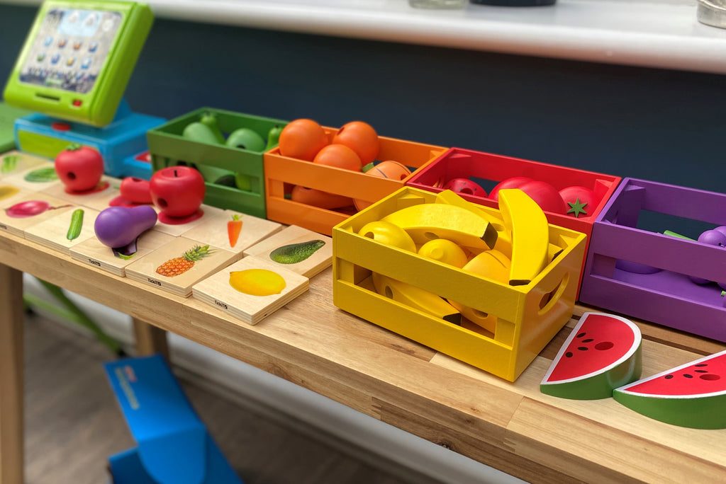 Wooden fruit and vegetable matching board with colorful picture pieces and trays