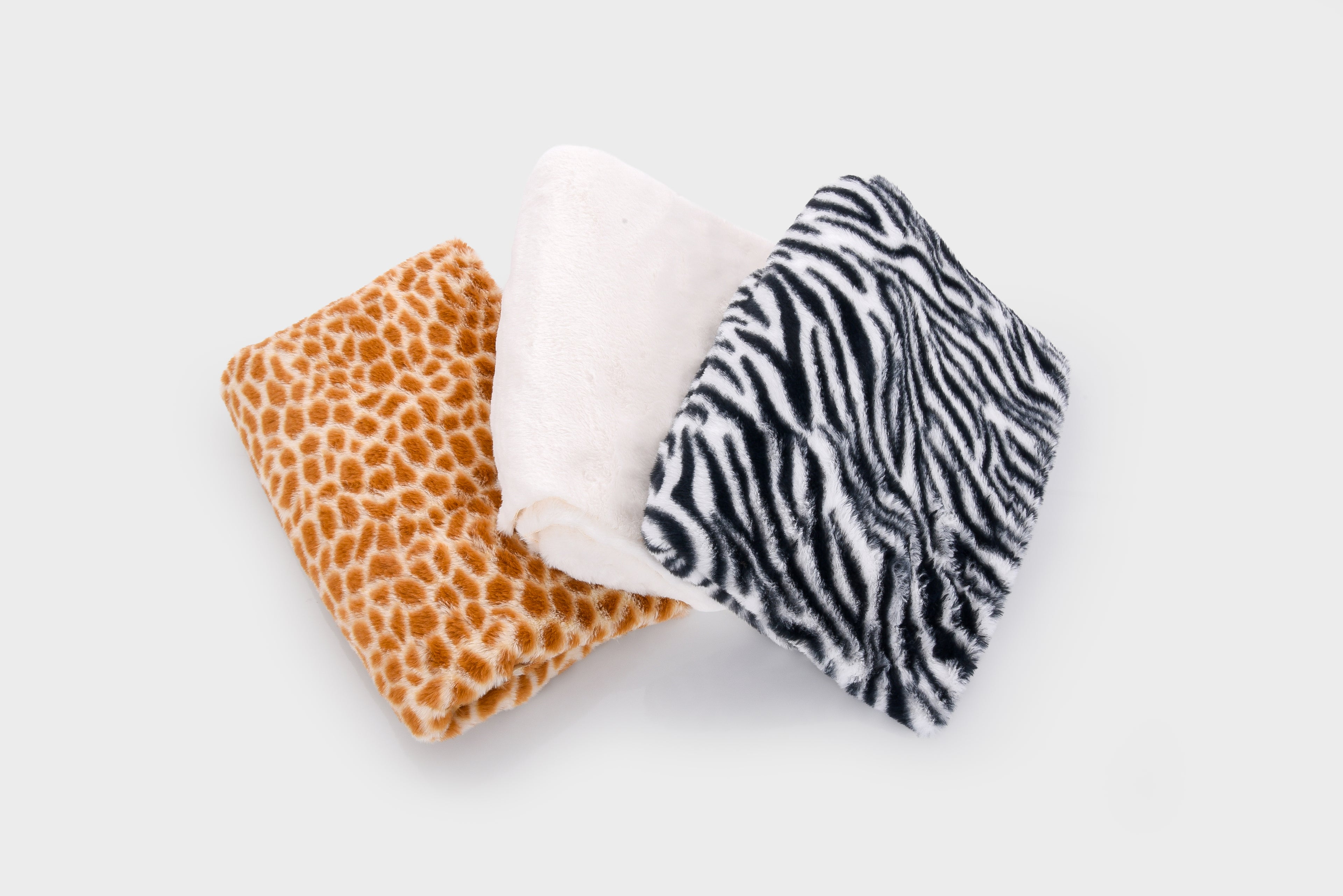 Fabric swatches bundle: orange giraffe print, white plush, black zebra print