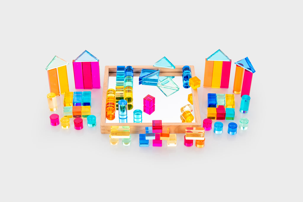 Gem building shapes tray with colorful transparent blocks, tubes, and small structure pieces
