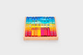 Wooden gem building shapes tray filled with colorful transparent blocks and tubes